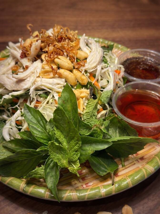 Shredded green papaya salad with shrimp, herbs, peanuts, and lime dressing